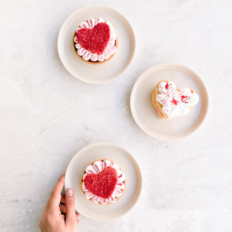 three small plates with mother's day cakes